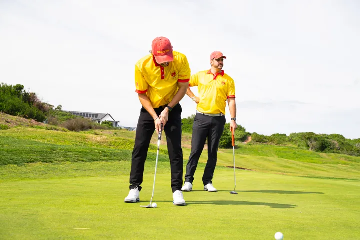Team members on the putting green